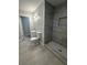 This elegant bathroom features a tiled walk-in shower and a sink with bright lighting at 4510 Burks Rd, Forest Park, GA 30297