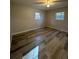 Comfortable bedroom with vinyl flooring and windows letting in ample natural light at 4510 Burks Rd, Forest Park, GA 30297