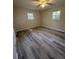 Bright bedroom with modern flooring and natural light from two windows at 4510 Burks Rd, Forest Park, GA 30297