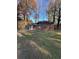 Cozy brick home with a well-kept front yard and mature trees at 4510 Burks Rd, Forest Park, GA 30297