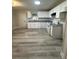 Well-lit kitchen with white cabinetry, modern appliances, and light-colored flooring at 4510 Burks Rd, Forest Park, GA 30297