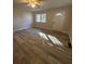 Inviting living room featuring modern flooring, a bright front door, and natural light at 4510 Burks Rd, Forest Park, GA 30297