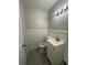 Charming powder room features a bright white vanity and modern lighting above the sink at 4510 Burks Rd, Forest Park, GA 30297
