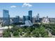 Aerial view of the skyline showcasing modern high-rise buildings nestled among lush greenery at 570 Martina Ne Dr, Atlanta, GA 30305
