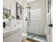 Sleek bathroom featuring a glass-enclosed shower with unique tile and modern fixtures at 570 Martina Ne Dr, Atlanta, GA 30305