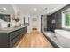 Bright bathroom featuring dual sinks, walk-in shower, soaker tub, and modern finishes at 570 Martina Ne Dr, Atlanta, GA 30305