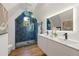 This bathroom has a unique tiled shower with window and double sink vanity at 570 Martina Ne Dr, Atlanta, GA 30305