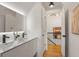 This bathroom features a double sink vanity with white cabinets and modern fixtures at 570 Martina Ne Dr, Atlanta, GA 30305