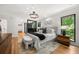Bright bedroom with decorative light fixture, modern furniture and accents, and large window at 570 Martina Ne Dr, Atlanta, GA 30305