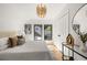 This bedroom features large windows, light hardwood floors, and a modern light fixture at 570 Martina Ne Dr, Atlanta, GA 30305