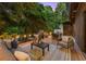 Relaxing outdoor deck area with comfortable seating, string lights, and privacy at 570 Martina Ne Dr, Atlanta, GA 30305