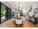 Open dining room features hardwood floors, modern lighting, and stylish decor at 570 Martina Ne Dr, Atlanta, GA 30305