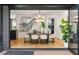 Dining room with hardwood floors, modern light fixture, and open access to more rooms at 570 Martina Ne Dr, Atlanta, GA 30305