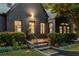 Stylish exterior with dark brick, manicured landscaping, and well-lit entrance at 570 Martina Ne Dr, Atlanta, GA 30305