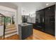 Modern kitchen with granite countertops, stainless steel appliances, and black cabinetry at 570 Martina Ne Dr, Atlanta, GA 30305