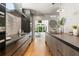 Sleek modern kitchen with stainless steel appliances, granite countertops, and ample cabinet space at 570 Martina Ne Dr, Atlanta, GA 30305