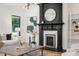 Bright living room featuring a fireplace, hardwood floors, and modern decor at 570 Martina Ne Dr, Atlanta, GA 30305