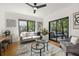 Inviting living room with hardwood floors, comfortable seating, and access to an outdoor patio at 570 Martina Ne Dr, Atlanta, GA 30305