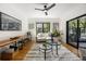 Bright living room featuring hardwood floors, modern decor, and sliding glass doors to patio at 570 Martina Ne Dr, Atlanta, GA 30305