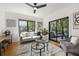 Sun-filled living room showcasing hardwood floors, stylish furniture, and access to outdoor space at 570 Martina Ne Dr, Atlanta, GA 30305