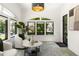 Bright living room with white brick walls, arched windows, and stylish decor at 570 Martina Ne Dr, Atlanta, GA 30305