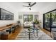 Bright living room boasts hardwood floors, stylish furniture, and sliding glass doors to the outdoor space at 570 Martina Ne Dr, Atlanta, GA 30305