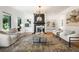 Inviting living room with hardwood floors, a fireplace, and abundant natural light at 570 Martina Ne Dr, Atlanta, GA 30305
