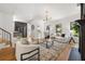 Open living room with hardwood floors, fireplace, and modern furnishings at 570 Martina Ne Dr, Atlanta, GA 30305