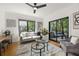 Inviting living room with comfortable seating, hardwood floors and seamless access to a covered patio at 570 Martina Ne Dr, Atlanta, GA 30305