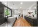 The main bathroom has hardwood floors, double sinks, a soaking tub, and a modern shower at 570 Martina Ne Dr, Atlanta, GA 30305