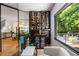 Office space with a wine rack and cooler, next to a large window with a view of the yard at 570 Martina Ne Dr, Atlanta, GA 30305