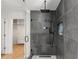 Shower featuring sleek tile work, modern fixtures, and glass enclosure at 570 Martina Ne Dr, Atlanta, GA 30305