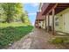 A backyard with a line of green bushes and back porches at 6887 Slate Stone Se Way # 3, Mableton, GA 30126