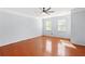 Large primary bedroom with light blue walls and hardwood floors at 6887 Slate Stone Se Way # 3, Mableton, GA 30126