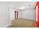 Carpeted bedroom with white walls and red accent trim throughout the room at 6887 Slate Stone Se Way # 3, Mableton, GA 30126