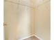 Empty closet with a rack for hanging clothes and beige walls at 6887 Slate Stone Se Way # 3, Mableton, GA 30126