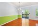 Dining area with hardwood floors and sliding door access to outdoor deck at 6887 Slate Stone Se Way # 3, Mableton, GA 30126