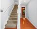 Inviting entrance featuring hardwood floors, stairs, and neutral wall paint at 6887 Slate Stone Se Way # 3, Mableton, GA 30126