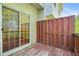 Back porch features a sliding glass door and a red painted wood fence at 6887 Slate Stone Se Way # 3, Mableton, GA 30126