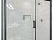 Contemporary shower showcasing white subway tile and a black-framed glass door at 6887 Slate Stone Se Way # 3, Mableton, GA 30126