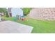 A level backyard features a patio and playset. The yard is ready for entertaining and Gathering fun at 779 Avonley Creek Trce, Sugar Hill, GA 30518