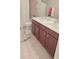 This bathroom features a double sink vanity with dark cabinets and a tub and shower combo at 779 Avonley Creek Trce, Sugar Hill, GA 30518