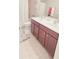 Bathroom featuring double sinks with storage and shower with curtain at 779 Avonley Creek Trce, Sugar Hill, GA 30518