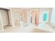 This luxurious bathroom features a glass enclosed shower and a soaking tub bathed in natural light at 779 Avonley Creek Trce, Sugar Hill, GA 30518