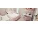 bedroom featuring a canopy bed and white vanity at 779 Avonley Creek Trce, Sugar Hill, GA 30518