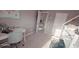bedroom featuring gray walls, white trim, and desk with gray office chair at 779 Avonley Creek Trce, Sugar Hill, GA 30518