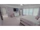 The spacious bedroom features an ensuite bathroom, plush carpet, and natural light at 779 Avonley Creek Trce, Sugar Hill, GA 30518