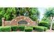 Stone and brick entrance sign for the Avonley Creek community amidst lush landscaping at 779 Avonley Creek Trce, Sugar Hill, GA 30518