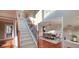 Spacious foyer with staircase leading to an open dining area, showcasing the home's layout at 779 Avonley Creek Trce, Sugar Hill, GA 30518