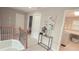 A welcoming hallway with hardwood stairs leads to the bedrooms and a laundry room at 779 Avonley Creek Trce, Sugar Hill, GA 30518